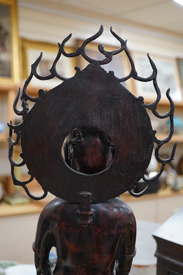 A large Chinese bronze and champleve enamel figure of a Bodhisattva, archaic style seal mark to base, 66cm